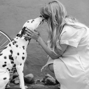 A woman with a dog, showing real care in how each other are